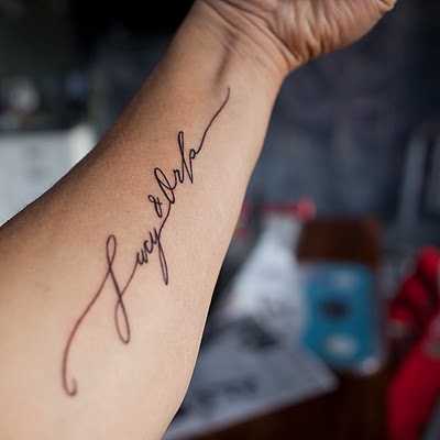 A meaningful handwritten or script tattoo I think they look classy and 